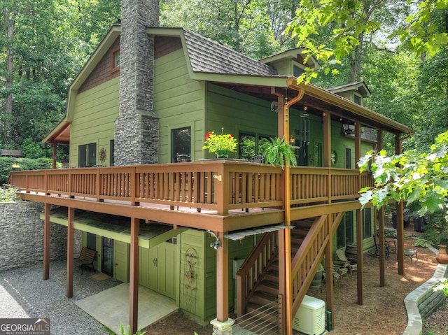 744 Dover Falls Trl, Ellijay, GA 30540 - rear view of house with a wooden deck, a chimney, a shingled roof, and a patio