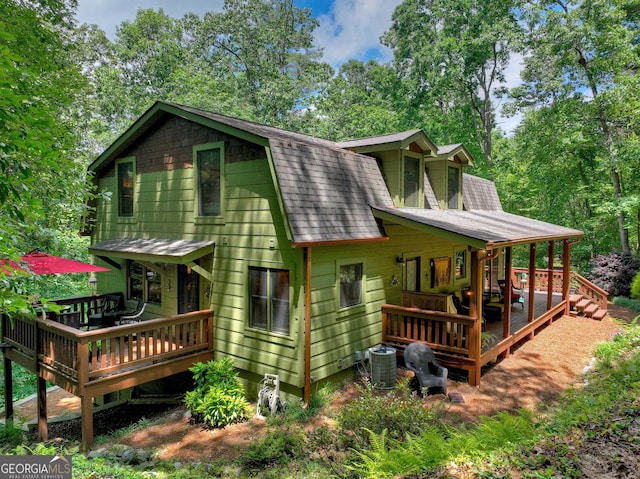 744 Dover Falls Trl, Ellijay, GA 30540 - rear view of property featuring roof with shingles, a gambrel roof, a deck, and view of scattered trees