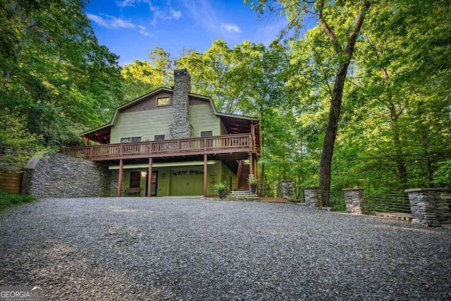 744 Dover Falls Trl, Ellijay, GA 30540 - back of property featuring driveway, a deck, and a chimney