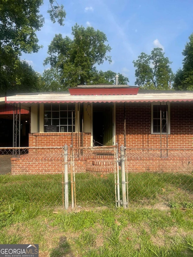 914 Bowden St, Savannah, GA 31415 - view of front of home with brick siding and covered porch