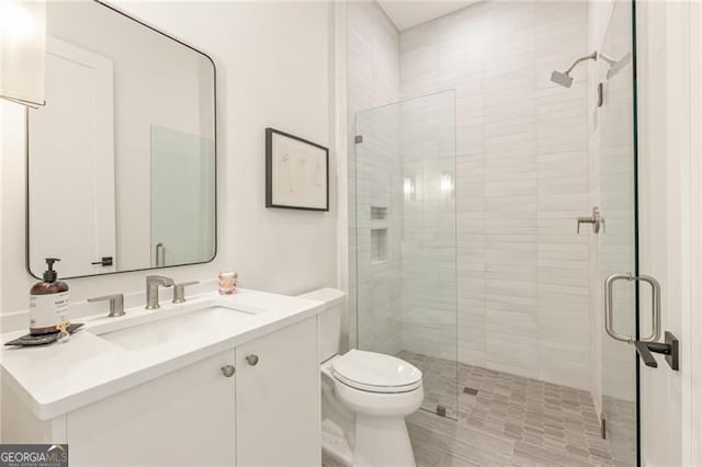 370 2nd St, Fayetteville, GA 30214 - bathroom featuring a shower stall, vanity, and toilet