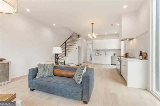 370 2nd St, Fayetteville, GA 30214 - living area featuring light wood finished floors, stairway, a chandelier, and recessed lighting