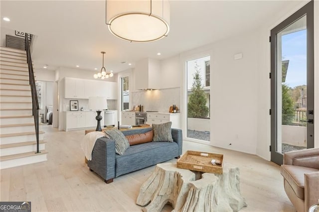 370 2nd St, Fayetteville, GA 30214 - living room with stairway, a chandelier, recessed lighting, and light wood-type flooring