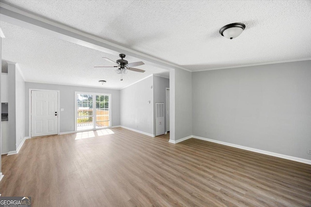 165 Forest Hill Dr, Eatonton, GA 31024 - unfurnished living room with a textured ceiling, wood finished floors, a ceiling fan, crown molding, and baseboards