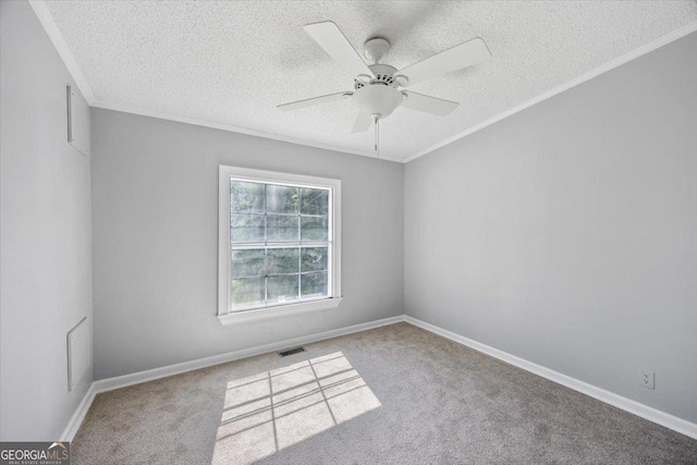 165 Forest Hill Dr, Eatonton, GA 31024 - spare room featuring a textured ceiling, carpet flooring, a ceiling fan, ornamental molding, and baseboards