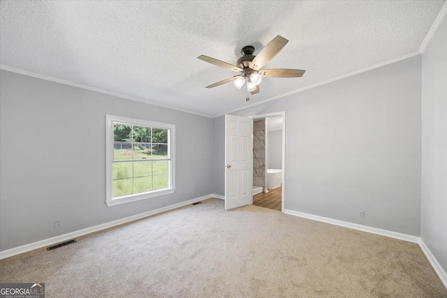165 Forest Hill Dr, Eatonton, GA 31024 - unfurnished bedroom featuring crown molding, a textured ceiling, carpet floors, baseboards, and ceiling fan