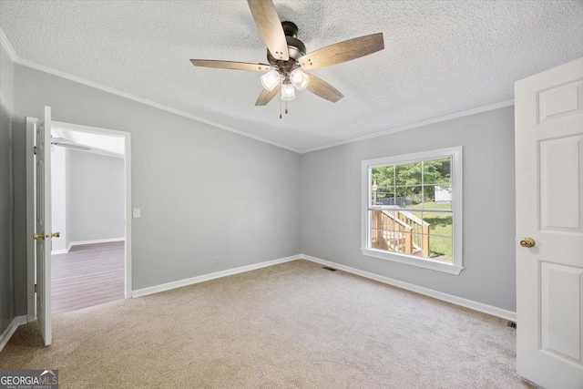 165 Forest Hill Dr, Eatonton, GA 31024 - unfurnished room with carpet floors, a textured ceiling, ornamental molding, a ceiling fan, and baseboards