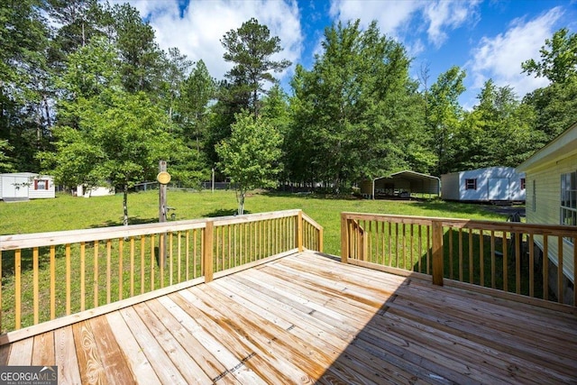 165 Forest Hill Dr, Eatonton, GA 31024 - deck featuring a carport, a yard, and view of scattered trees
