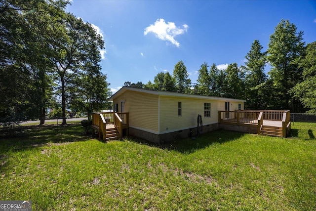 165 Forest Hill Dr, Eatonton, GA 31024 - rear view of house with a wooden deck and crawl space