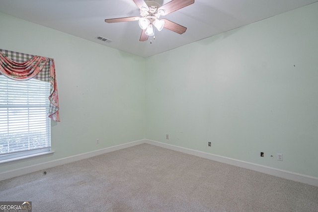 1521 Walthour Rd, Savannah, GA 31410 - spare room with carpet floors, baseboards, and ceiling fan