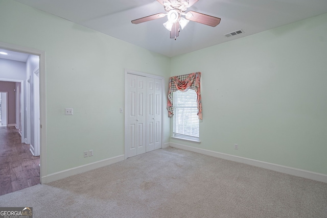 1521 Walthour Rd, Savannah, GA 31410 - unfurnished bedroom with carpet flooring, baseboards, a closet, and a ceiling fan