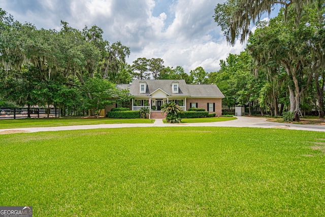 1521 Walthour Rd, Savannah, GA 31410 - view of front facade with concrete driveway and a porch