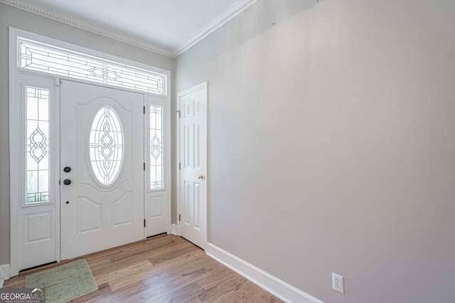 1521 Walthour Rd, Savannah, GA 31410 - foyer featuring crown molding, light wood-type flooring, and baseboards