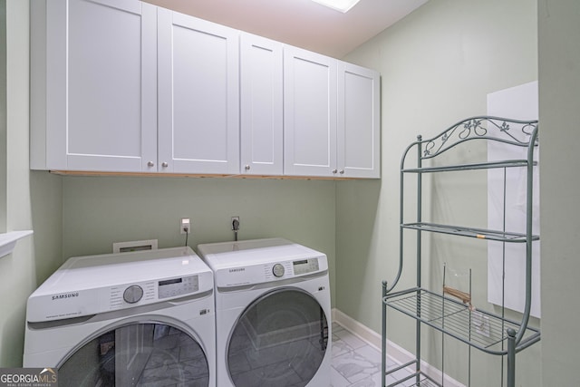 1521 Walthour Rd, Savannah, GA 31410 - laundry area with cabinet space, light marble finish flooring, independent washer and dryer, and baseboards