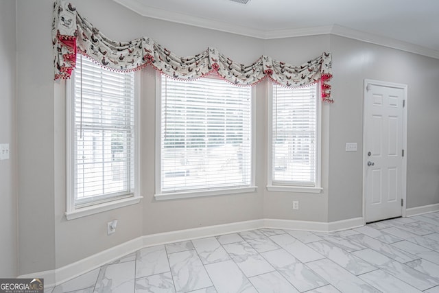 1521 Walthour Rd, Savannah, GA 31410 - unfurnished dining area with light marble finish floors, plenty of natural light, and ornamental molding