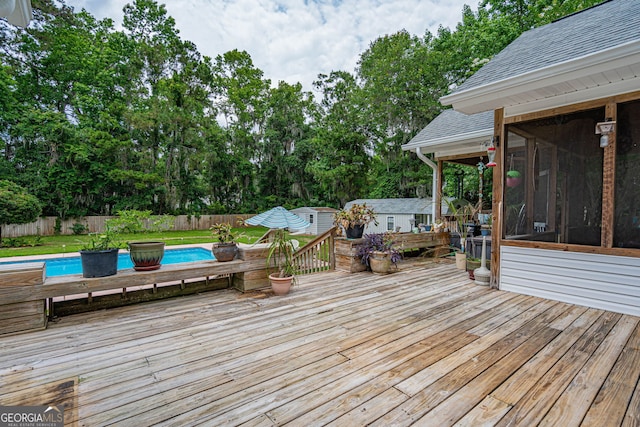 1521 Walthour Rd, Savannah, GA 31410 - deck with a fenced backyard, a sunroom, and view of scattered trees