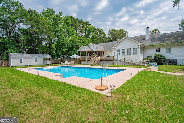 1521 Walthour Rd, Savannah, GA 31410 - view of swimming pool featuring a wooden deck, an outdoor structure, a patio, and stairs