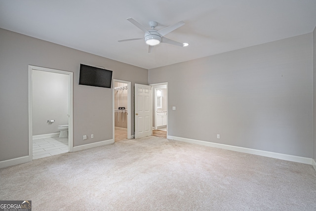 1521 Walthour Rd, Savannah, GA 31410 - unfurnished bedroom with light colored carpet, ensuite bathroom, baseboards, and a ceiling fan