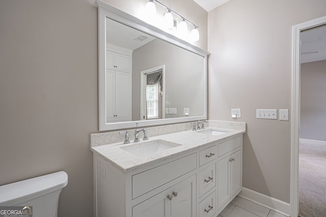 1521 Walthour Rd, Savannah, GA 31410 - full bath featuring toilet, double vanity, and baseboards