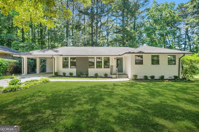 3337 Toney Dr, Decatur, GA 30032 - view of front facade featuring brick siding, a carport, a front lawn, and concrete driveway