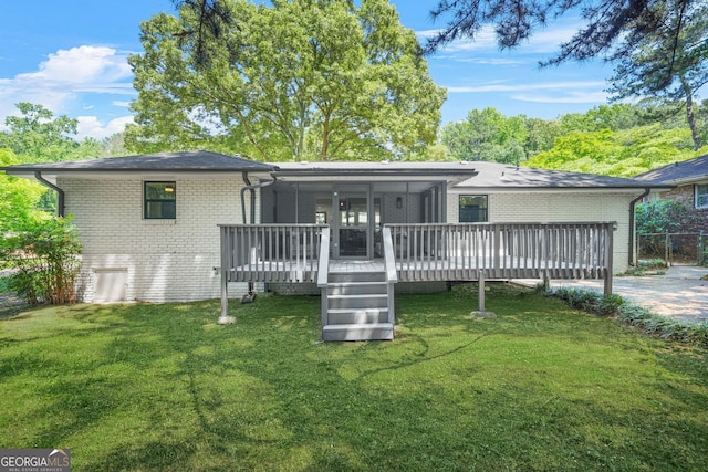 3337 Toney Dr, Decatur, GA 30032 - back of property featuring brick siding, a yard, a wooden deck, and a garage