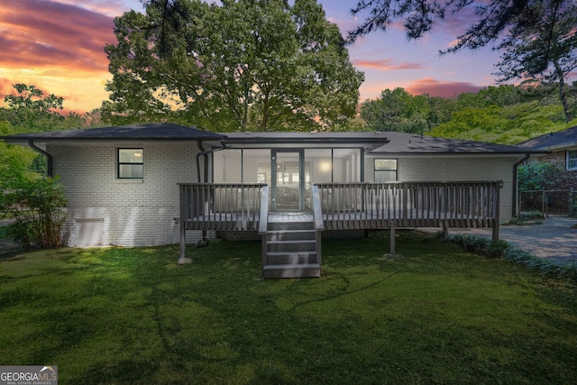 3337 Toney Dr, Decatur, GA 30032 - back of house featuring brick siding, a deck, and a yard