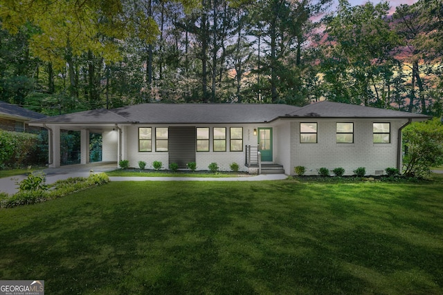 3337 Toney Dr, Decatur, GA 30032 - view of front of home with brick siding, a carport, and a front yard