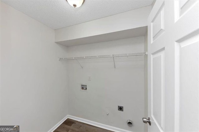11827 Spring Lake Way, Fayetteville, GA 30215 - laundry area with electric dryer hookup, baseboards, dark wood-type flooring, hookup for a washing machine, and a textured ceiling