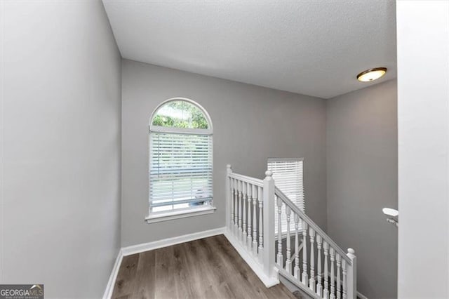11827 Spring Lake Way, Fayetteville, GA 30215 - stairs featuring baseboards, wood finished floors, and a textured ceiling