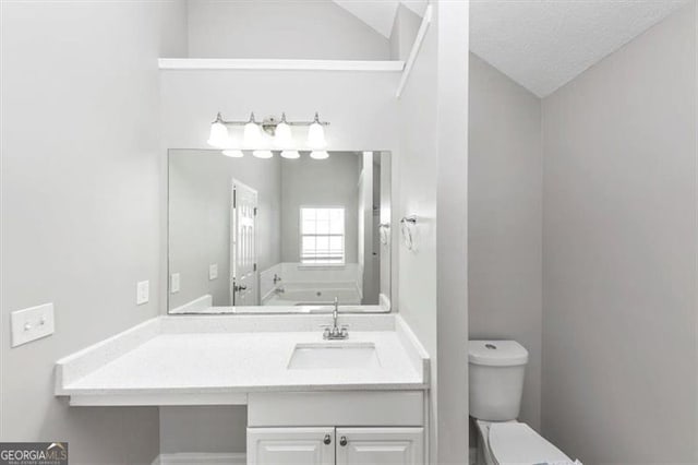 11827 Spring Lake Way, Fayetteville, GA 30215 - bathroom featuring toilet, lofted ceiling, vanity, and a garden tub