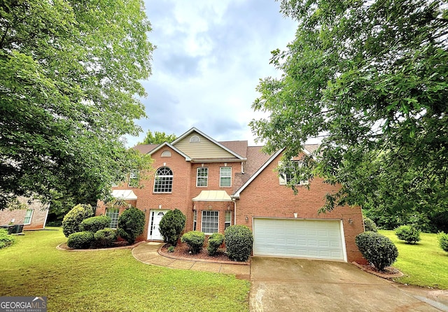 759 Hennepin Ter, Mcdonough, GA 30253 - traditional-style house featuring brick siding, concrete driveway, an attached garage, and a front yard