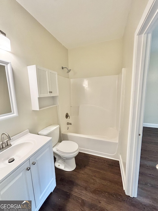 759 Hennepin Ter, Mcdonough, GA 30253 - bathroom with vanity, wood finished floors, tub / shower combination, and toilet