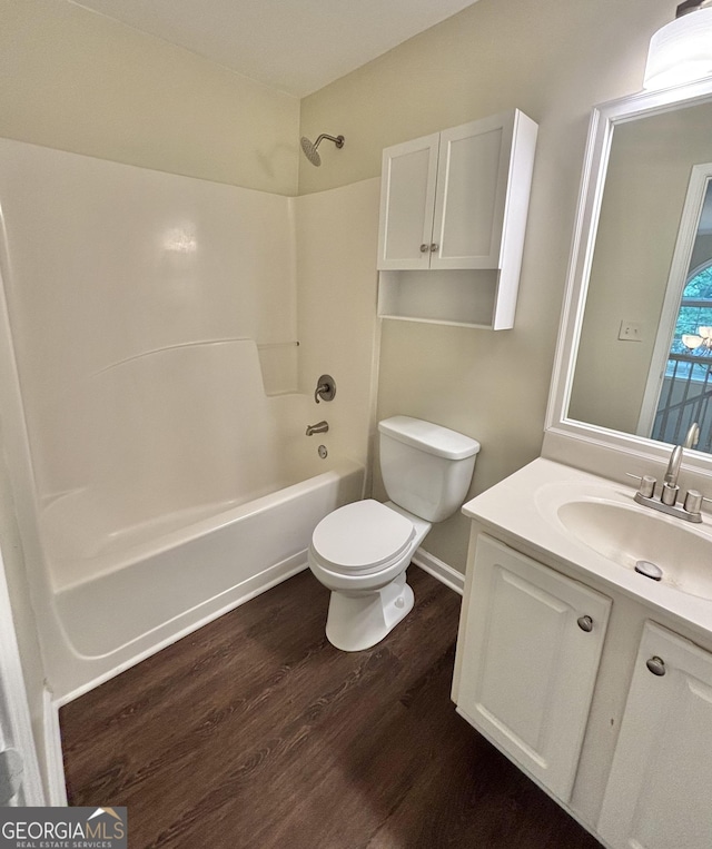 759 Hennepin Ter, Mcdonough, GA 30253 - full bath with toilet, wood finished floors, vanity, and  shower combination