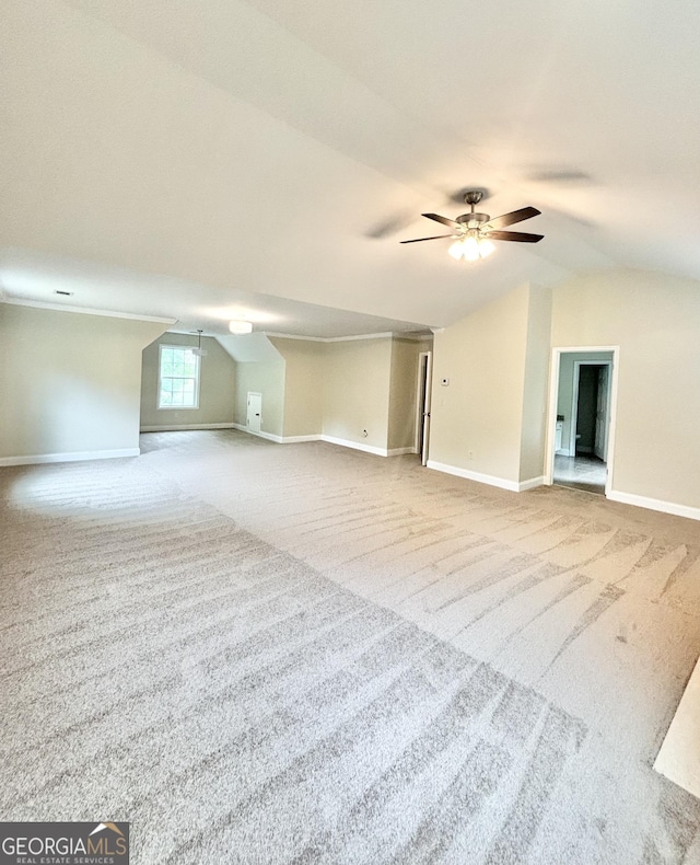 759 Hennepin Ter, Mcdonough, GA 30253 - unfurnished living room with carpet, lofted ceiling, baseboards, and ceiling fan