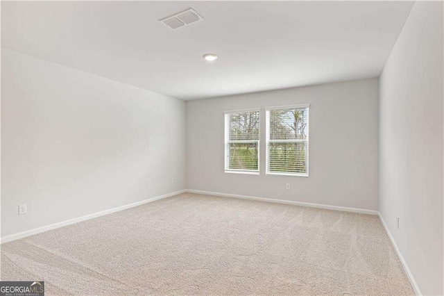 7193 Brushwood Bnd, Lithonia, GA 30058 - spare room with light colored carpet and baseboards