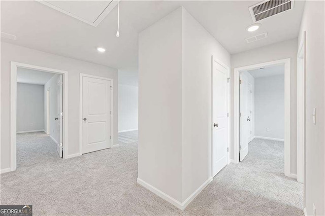 7193 Brushwood Bnd, Lithonia, GA 30058 - hallway featuring carpet, attic access, and baseboards