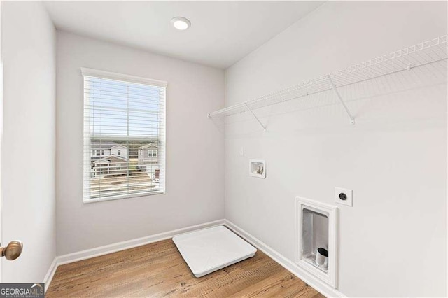 7193 Brushwood Bnd, Lithonia, GA 30058 - laundry area featuring hookup for a washing machine, hookup for an electric dryer, baseboards, light wood-style floors, and recessed lighting