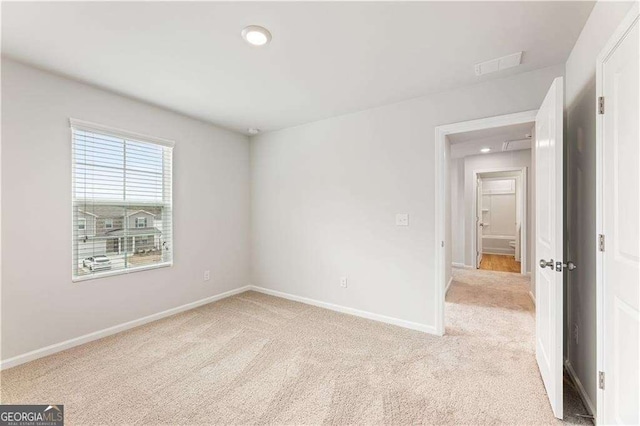 7193 Brushwood Bnd, Lithonia, GA 30058 - spare room with light colored carpet, baseboards, and recessed lighting
