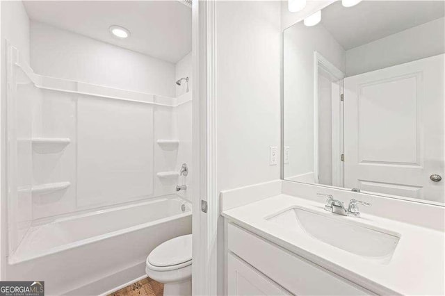 7193 Brushwood Bnd, Lithonia, GA 30058 - full bath with vanity, toilet, washtub / shower combination, wood finished floors, and recessed lighting