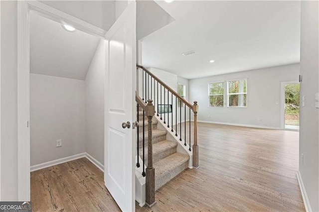 7193 Brushwood Bnd, Lithonia, GA 30058 - staircase with wood finished floors and baseboards
