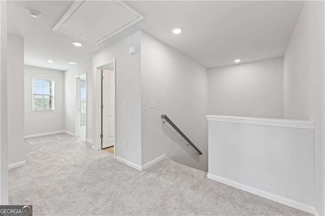 7193 Brushwood Bnd, Lithonia, GA 30058 - hallway featuring attic access, an upstairs landing, carpet flooring, baseboards, and recessed lighting