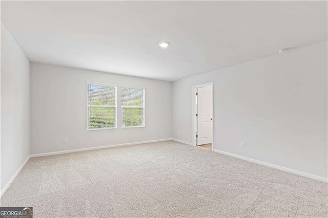 7193 Brushwood Bnd, Lithonia, GA 30058 - unfurnished room featuring baseboards, carpet, and recessed lighting