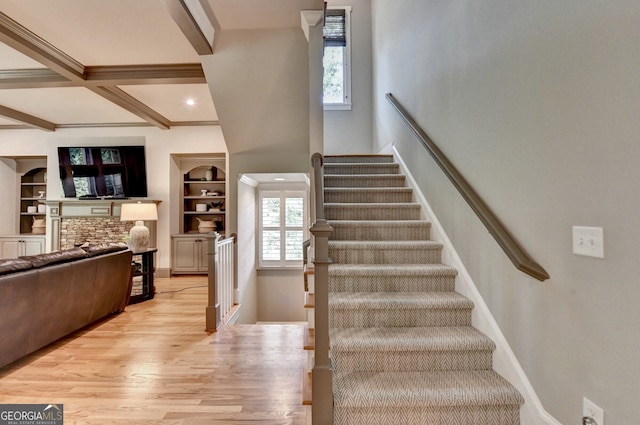 3715 Horizon Ct, Cumming, GA 30041 - staircase featuring wood finished floors, beam ceiling, coffered ceiling, a stone fireplace, and recessed lighting