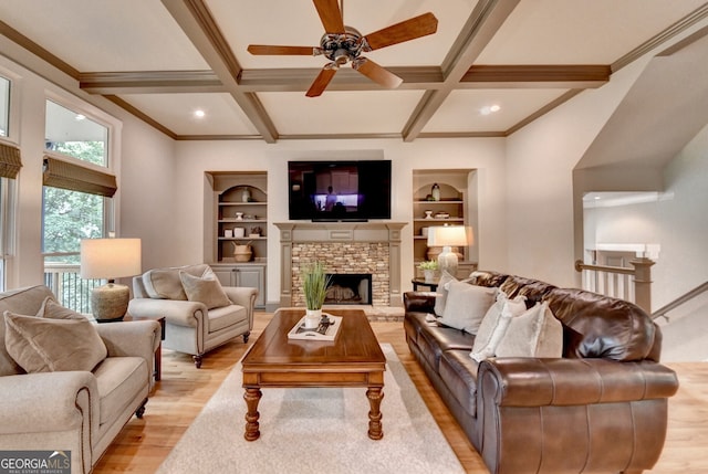 3715 Horizon Ct, Cumming, GA 30041 - living room featuring light wood-style flooring, beamed ceiling, a ceiling fan, coffered ceiling, and a stone fireplace