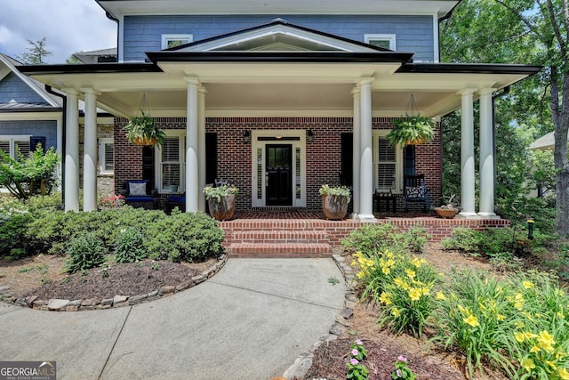 3715 Horizon Ct, Cumming, GA 30041 - property entrance featuring covered porch and brick siding