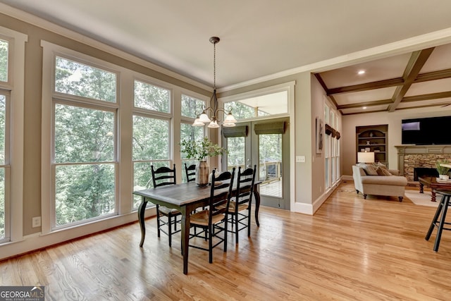 3715 Horizon Ct, Cumming, GA 30041 - dining room featuring healthy amount of natural light, built in shelves, a chandelier, light wood-style flooring, and beamed ceiling