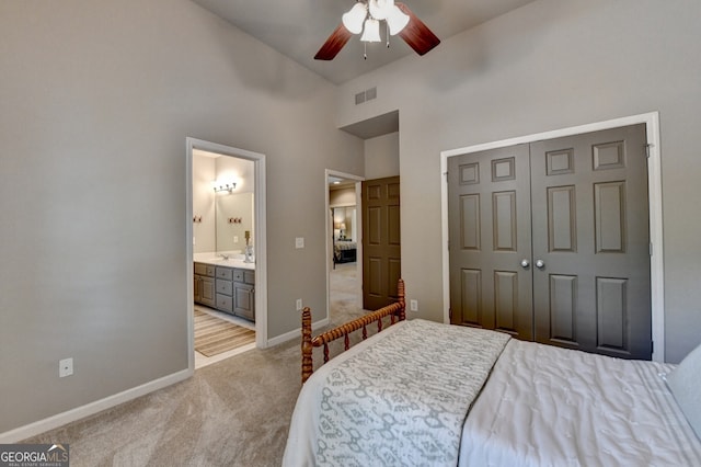 3715 Horizon Ct, Cumming, GA 30041 - bedroom featuring light carpet, a closet, a ceiling fan, ensuite bathroom, and a towering ceiling