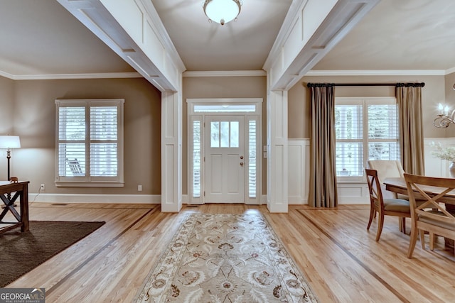 3715 Horizon Ct, Cumming, GA 30041 - foyer featuring plenty of natural light, light wood finished floors, and crown molding