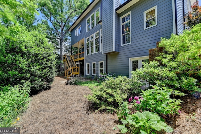 3715 Horizon Ct, Cumming, GA 30041 - back of house featuring stairs and a wooden deck