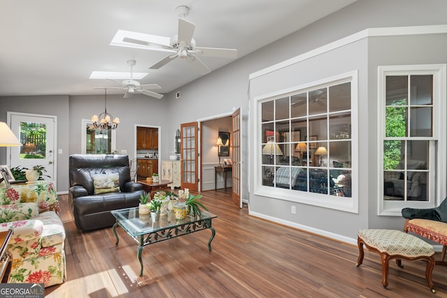 1850 Linnet Ct NE, Roswell, GA 30075 - living room featuring a chandelier, wood finished floors, ceiling fan, and baseboards